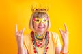 Crazy senior woman funky action smile. Happy smiling senior man on yellow background. Concepts about senior people Royalty Free Stock Photo