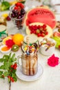 Crazy shake on top with marshmallow, waffles, biscuits and sweets on a bright colored background Royalty Free Stock Photo