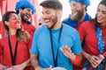 Crazy sport fans screaming while supporting their team out of the stadium - Focus on left girl face Royalty Free Stock Photo