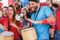 Crazy sport fans screaming while supporting their team out of the stadium - Focus on right man face Royalty Free Stock Photo