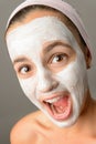 Crazy teenage girl face mask open mouth Royalty Free Stock Photo