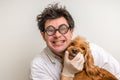 Crazy veterinarian and funny smiling dog Royalty Free Stock Photo