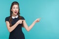 Crazy woman pointing finger at copy space. Royalty Free Stock Photo