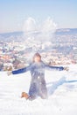 Crazy woman throws white snow, winter scene Royalty Free Stock Photo