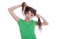 Crazy young girl playing with her hair making grimace. Royalty Free Stock Photo