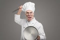 Enraged chef with knife and lid