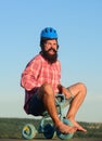 Crazy Young man riding three wheeled bicycle. Nerdy hipster guy riding a small bicycle. Royalty Free Stock Photo