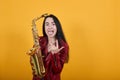 Crazy woman depicting heavy metal rock sign horns up gesture, showing tongue