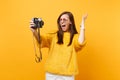 Crazy young woman in heart glasses screaming spreading hands doing taking selfie shot on retro vintage photo camera Royalty Free Stock Photo