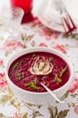 Cream of beetroot soup with sliced fennel and fresh herbs Royalty Free Stock Photo