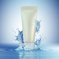 Cream bottle mock up in water splash on blue background. Royalty Free Stock Photo