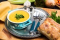 Cream broccoli soup on a silver tray