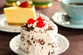 Cream cake decorated with chocolate flake & cherry Royalty Free Stock Photo