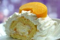 Cream cake with a peach slice