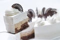 Cream cake on white plate, chocolate decoration with cake, patisserie, sweet tart with cocoa cream