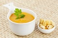 Cream of carrot soup and bread croutons