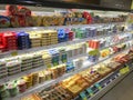 Cream cheese and curd assortment lying in a showcase in a supermarket