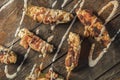 Cream Cheese Filled Bacon Wrapped Jalapeno Poppers On Wood Background