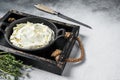 Cream cheese Mascarpone in a wooden tray for tiramisu. White background. Top view. Copy space