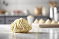 Cream cheese pastry dough on white table in modern kitchen.