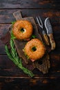 Cream cheese and smoked salmon bagel, on old dark  wooden table background, top view flat lay Royalty Free Stock Photo