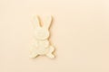 Cream color rabbit shaped soap.Hand made soap bars on camel color background, top view. Space for text. Zero waste concept