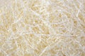 Cream color shredded paper - gift box filler. Royalty Free Stock Photo