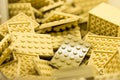 Cream colored building blocks with focus and highlight on one selected block with available light Royalty Free Stock Photo