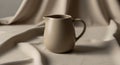 Cream-colored ceramic pitcher with a smooth, Royalty Free Stock Photo