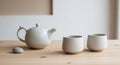 Cream-colored ceramic teapot with a smooth, Royalty Free Stock Photo