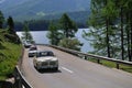 A cream-colored Volvo Amazon and other classic cars