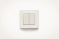 Cream colored wall mounted cream colored double light switch Royalty Free Stock Photo
