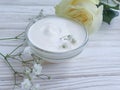 Cream cosmetic softening therapy sensitive flower wellness on wooden background ointment