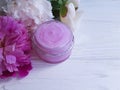 cream cosmetic peony flower wellness cosmetology on wooden Royalty Free Stock Photo