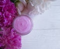 cream facial glass cosmetic peony flower wellness cosmetology on wooden Royalty Free Stock Photo