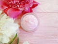 Cream cosmetic protection petal bloom peony cleanser moisturizing spring aromatherapy flower wooden background