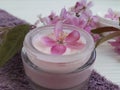 Cream cosmetic relaxation flowers beauty organic protection wellness product handmade on blue wooden