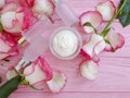 Cream cosmetic rose flower natural on wooden background