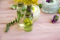 Cream cosmetic, wild flowers, essence vintage on a wooden background Royalty Free Stock Photo