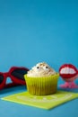 Cream cupcake with funny atrezzo Royalty Free Stock Photo