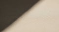 Cream and dark gray fabric surfaces create a diagonal division. The texture is finely woven, Royalty Free Stock Photo