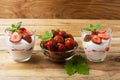 Cream dessert with strawberries on dark wooden background Royalty Free Stock Photo