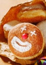 Cream doughnut with a happy clown face Royalty Free Stock Photo