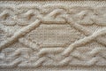 Cream handmade knitwork with horizontal plait pattern