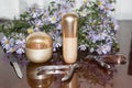 Cream jars and nail accessories on a wooden polished table with