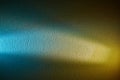 Cream and light blue rays of light on a blue yellow textural background Royalty Free Stock Photo