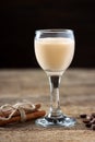Cream liqueur on wooden table