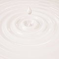 Cream or milk liquid drop with waves