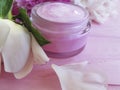 Cream moisturize cosmetic, peony flower treatment rustic on a pink wooden background Royalty Free Stock Photo