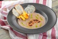 Cream of mushroom soup in dark bowl. Homemade creamy soupe with sliced boletus mushrooms. Royalty Free Stock Photo